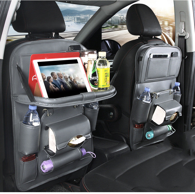 Gray RoadTrip car backseat organizer set on both front seats with tablet tray and drink pockets