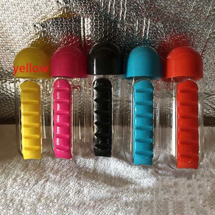 DailyDose pillbox water bottles lined up showing all 5 available colors: yellow, pink, black, teal, and red