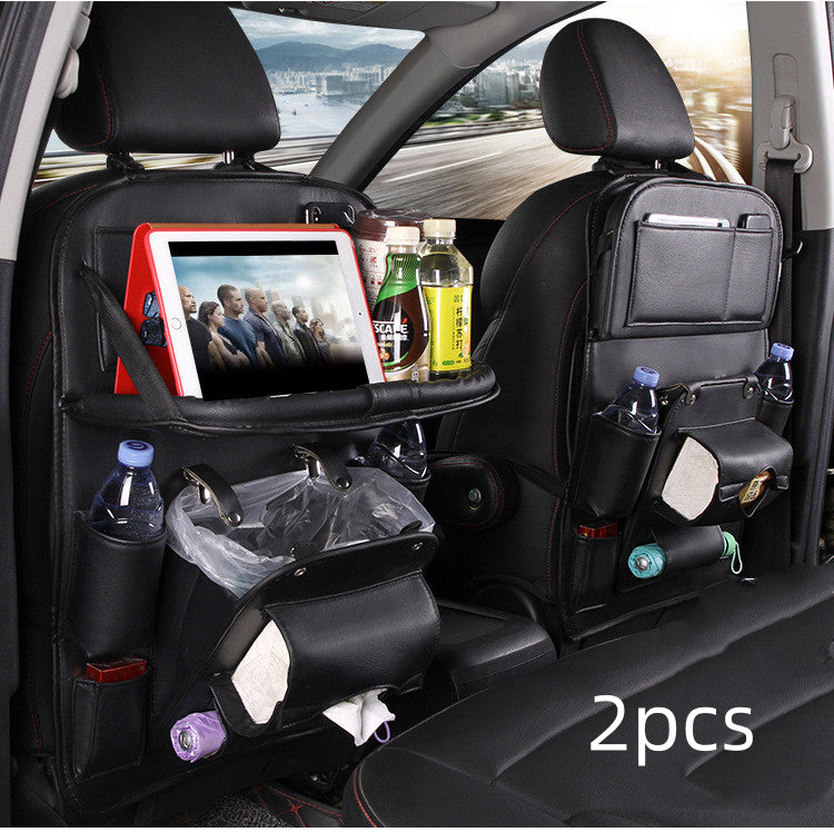 Black RoadTrip car backseat organizer 2-piece set installed on front seats with tablet tray and trash bag