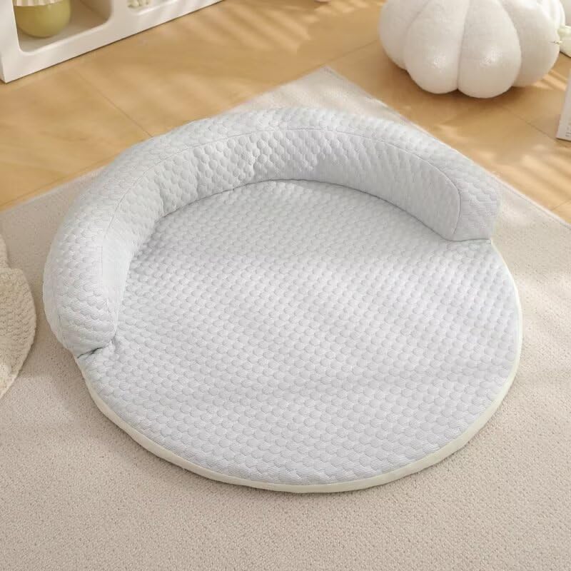White quilted CoolPaws round pet cooling mat on beige rug