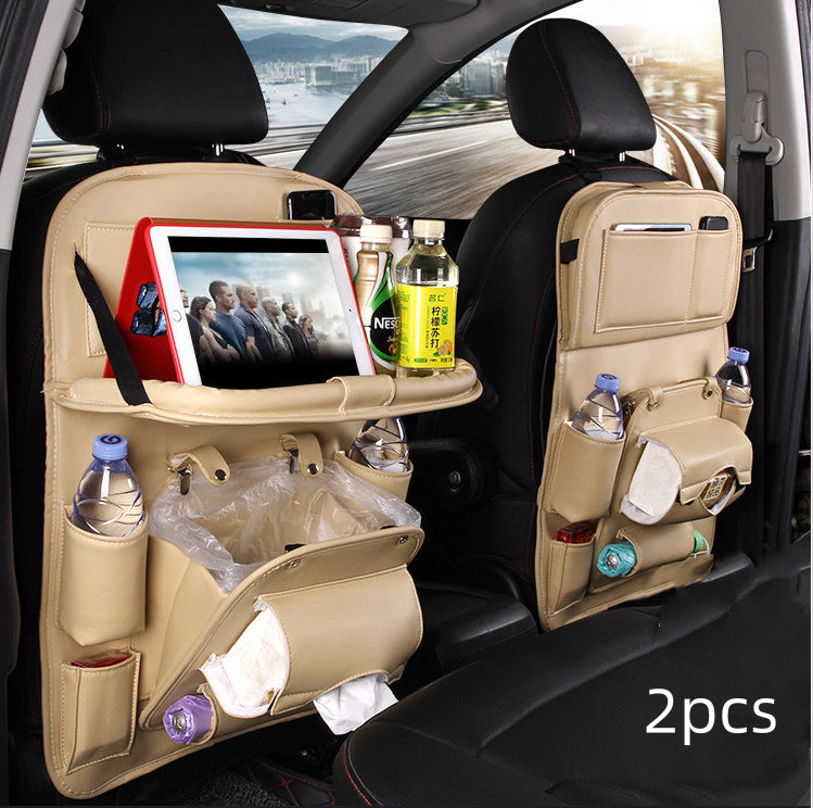 Beige RoadTrip car backseat organizer 2-piece set installed on front seats with tablet tray and trash bag