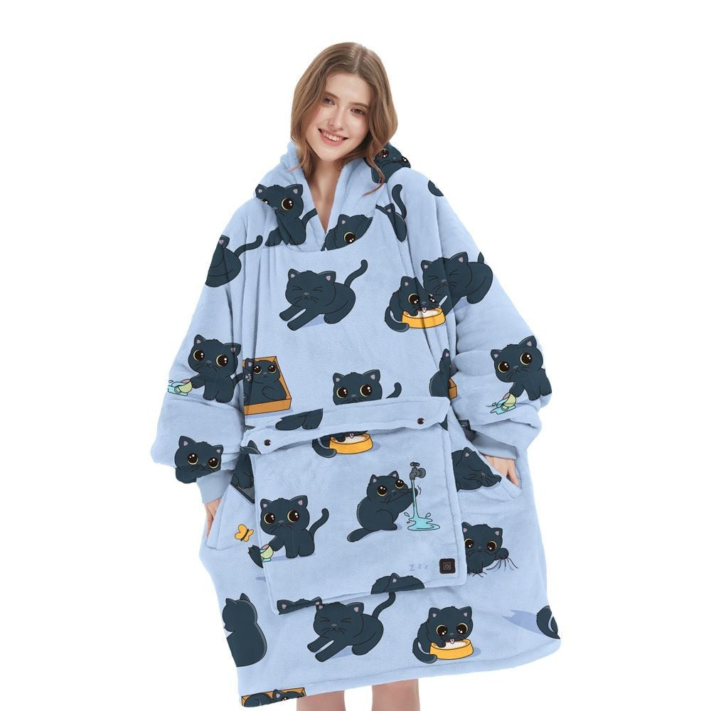 Woman wearing light blue cat print CozyGlow wearable heated hoodie blanket on white background