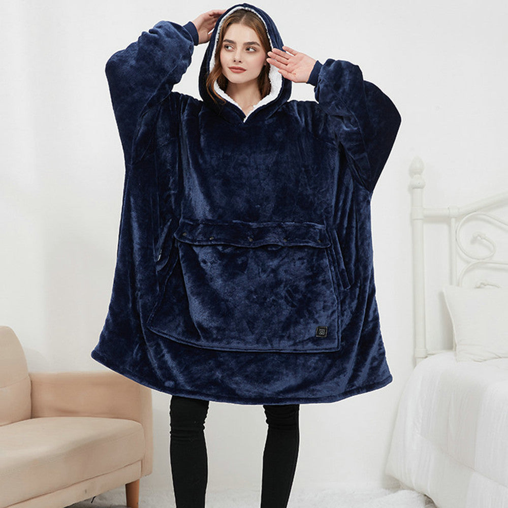Woman wearing navy blue CozyGlow heated hoodie blanket with hood up showing white sherpa lining