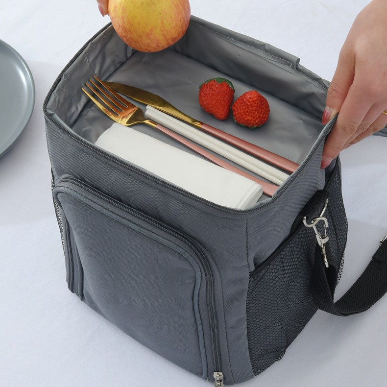Top view of gray ChillPack insulated lunch bag packed with fruit and food