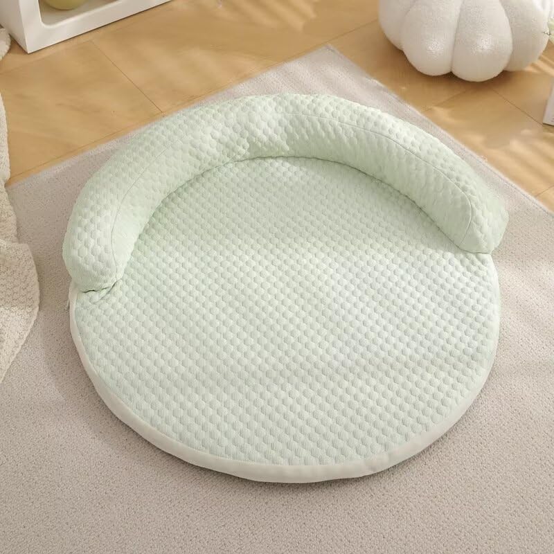 Mint green quilted CoolPaws round pet cooling mat on beige rug